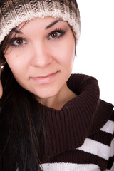 Poster - attractive brunette woman in winter clothes on white background