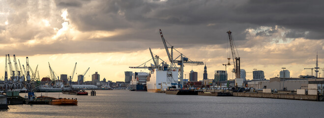 Wall Mural - sunset over the harbor of hamburg