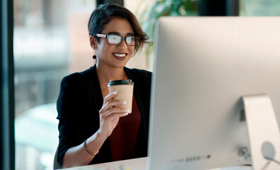 Business woman, coffee and computer in office planning, reading report and editing for online and creative project. Inspiration, happy ideas and professional worker or person with drink on desktop pc