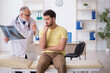 © Elnur - Young male patient visiting old male doctor radiologist