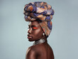 Black woman, profile and African turban, fashion and beauty with makeup isolated on studio background. Natural cosmetics, eyeshadow and female model with traditional head wrap, mockup space and style