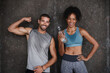 © A. Frank/peopleimages.com - Fitness, muscle flex and portrait of couple in city after workout, body builder training and exercise. Sports, water bottle and man and woman sweating after running for endurance, wellness and energy