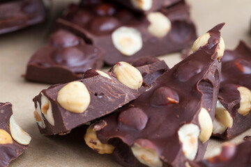 Wall Mural - Pieces of homemade milk chocolate with lots of hazelnuts