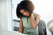 © Angelo J/peopleimages.com - Stress, anxiety or black woman in office with neck pain from job pressure or burnout fatigue in company. Bad posture injury problem, injured or tired girl employee depressed or frustrated by deadline