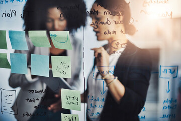 Canvas Print - Research, teamwork and business meeting by women planning schedule on digital tablet in office. Agenda, management and lady team online for solution, strategy or brainstorming mission on sticky note