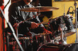 © 9parusnikov - Close-up of drummer drumsticks with a drum set.