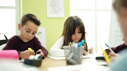 Sticker - Group of kids students sitting on table studying at classroom