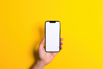 Wall Mural - phone in hand isolated on white, hand holding a smart phone with blank screen isolated on a yellow colored background