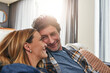 © Grady Reese/peopleimages.com - Face of couple, smile and relax in living room for quality time, love and care of support together at home. Happy man, mature woman and bonding on sofa for break, happiness or loyalty to life partner