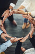 © Viglietti/peopleimages.com - Teamwork, solidarity and business people with their hands together in a circle for unity. Collaboration, friends and top view of multiracial employees with connection for team building in the office.