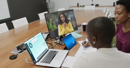 Wall Mural - Composition of diverse businesswomen using laptop with ai chat on screen