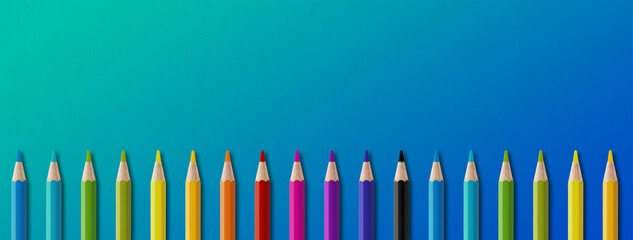 Poster - Colored pencil group isolated on blue. Panoramic banner background