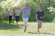 © auremar - group of people jogging on a summers day