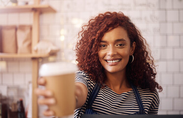 Canvas Print - Portrait, woman and smile of waitress with coffee cup in cafeteria, restaurant and small business store. Happy female barista, server and giving cappuccino, drinks order and friendly service in shop