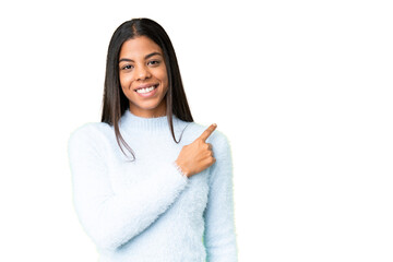 Wall Mural - Young African American woman over isolated chroma key background pointing to the side to present a product