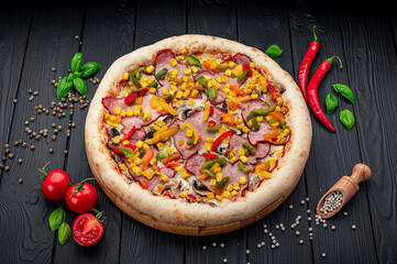 Wall Mural - Tasty and big pizza with different types of meat. Pizza with different types of ingredients, sweet paprika and mushrooms