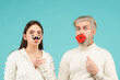 © Volodymyr - Concept of gender equality, equal rights for both sexes. Identity transgender, gender stereotypes. Funny couple of woman with moustache and man with red lips.