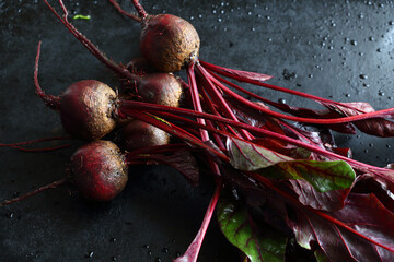 Wall Mural - Raw Beetroot with leaves on a baking sheet