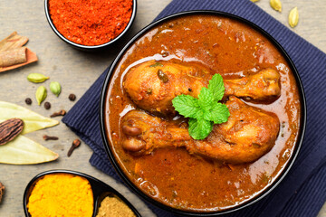 Wall Mural - Top view of spicy chicken curry, traditional murgh tari