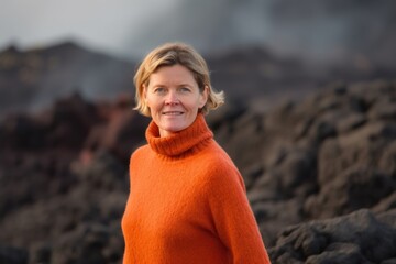 Sticker - Environmental portrait photography of a pleased woman in her 40s wearing a cozy sweater against a volcano or lava background. Generative AI