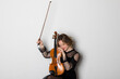 © Georgi - Young elegant blonde girl playing a violin. Portrait of a female violinist. Isolated on white background.