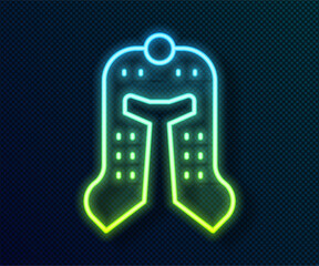 Sticker - Glowing neon line Medieval iron helmet for head protection icon isolated on black background. Vector