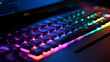 Working on a neon computer keyboard with colored backlighting. Computer video games, hacking, technology, internet concept. Selected focus.