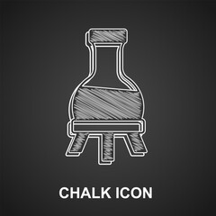 Chalk Test tube and flask chemical laboratory test icon isolated on black background. Laboratory glassware sign. Vector