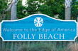 Welcome sign for Folly Beach located on Folly Island in Charleston County in South Carolina.  Folly Beach is called the edge of America and known for its breathtaking views.  