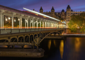 Bir de Hakeim, historic bridge in Paris France, dusk long exposure has blurred the cars and trains on this bridge crossing the River Seine