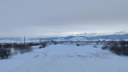 Bright snow field with tundra vegetation at 60fps