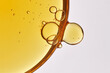 Close-up of oily facial serum drop.