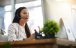 © Donson/peopleimages.com - Communication, customer services or woman in call center consulting, speaking or talking at help desk. Virtual assistant, friendly or sales consultant in telemarketing or telecom company office