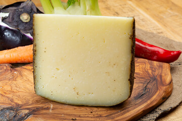 Cheese collection, aged hard Italian sheep cheese black pecorino from Sicily island or pecorino nero di Sicilia