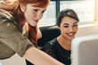 © Viglietti/peopleimages.com - Business woman, computer and coach with idea in team collaboration for strategy or planning at the office. Female mentor coaching or training staff on technology in teamwork for solution at workplace