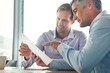 © Grady Reese/peopleimages.com - Paperwork, meeting and business men planning with spreadsheet, data analysis and statistics report for budget. Professional people, accountant partner or happy clients for documents or taxes advice