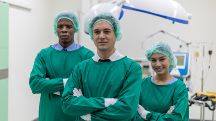 Team of medical doctors or surgeons from different nationalities stand with confident to  provide health care service to patient in a surgery room