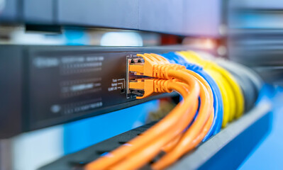 Canvas Print - colorful network cables connected on network switches panel in data center