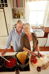 Wall Mural - Affection, smile or happy old couple kitchen cooking with love or healthy food for dinner together at home. Embrace or above of senior woman helping or hugging an elderly husband in meal preparation