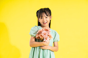 happy smiling asian girl on yellow background