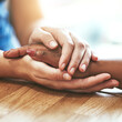 © L De Bruin/peopleimages.com - Support, closeup and people with care holding hands for hope, trust and empathy. Diversity, forgive and friends with a helping hand, respect and help through grief or consoling with connection