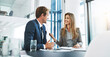 © Thurstan H/peopleimages.com - Corporate, staff and employees with collaboration, meeting and feedback in an office, happiness and conversation. Partnership, man and woman with startup success, talking and planning with target