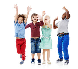 Joy, jumping and portrait of children in studio for diversity, friends and playing. Happiness, youth and smile with group of kids isolated on white background for celebration, playful and energy