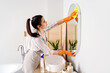 © Pixel-Shot - Young woman cleaning mirror in her bathroom