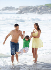 Sticker - Family, summer and swinging child at beach for fun, travel or holiday with a smile in water. A man, woman and kid or son playing together on vacation at sea with waves, love and happiness outdoor