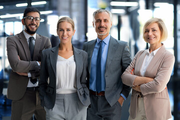 Poster - Group portrait of a professional business team looking confidently at camera.