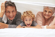 © N Katie/peopleimages.com - Portrait, grandparents or excited boy in bedroom to relax together for bonding in Australia with love or care. Morning, faces or happy grandmother with funny kid or old man to enjoy quality bed time
