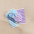 Flat lay summer vacation with beach towel, umbrella on sand background. 3d rendering  