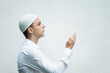 portrait of a Muslim believer isolated on a white background