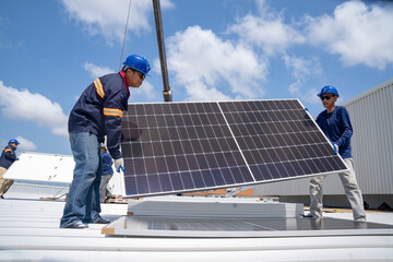 Wall Mural - asian mechanic checking roof solar panel maintenance a team of technicians installing solar panels o